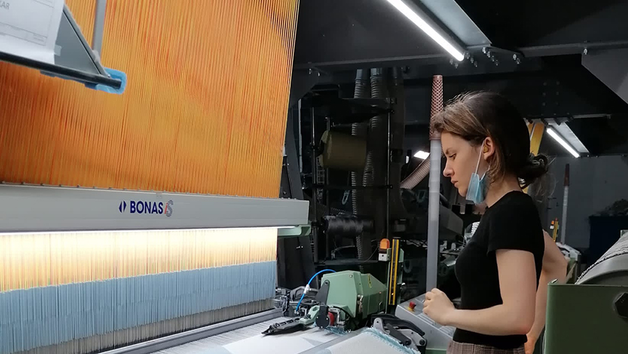 Behind the scenes photo of Fransje weaving Phila Carpet for Zuiver, by FransjeGimbrere